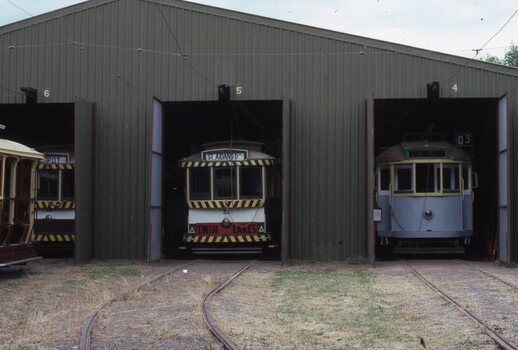 Trams 33 and 671 being repainted at the depot.