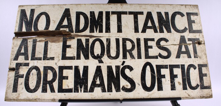 Safety sign directing enquiries to Foreman's office