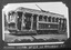 Vintage tramcar decorated with thousands of flowers for a celebration, with "VIEW POINT" visible on the front.