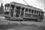 Vintage tramcar decorated with thousands of flowers for a celebration, with "VIEW POINT" visible on the front.