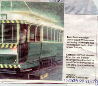 Newspaper, The Courier Ballarat, sheltering from the rain, 28/12/1999 12:00:00 AM