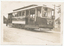 Tramcar numbered 69 with an "RUBICON STREET" sign, parked on a street with a man standing at the rear.