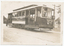 Tramcar numbered 69 with an "RUBICON STREET" sign, parked on a street with a man standing at the rear.
