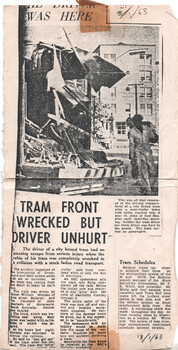 Newspaper clipping shows the aftermath of a tram accident, with a damaged tram and wreckage strewn across a street, and a person standing near the scene with a small paragraph about on-time running in Ballarat compared to that of Melbourne.