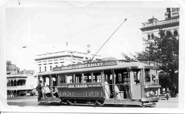 No. 23 painted as the Gold Tram in 1951, at the corner of Sturt and Lydiard St