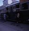 Trams and passengers.