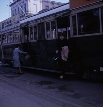 Trams and passengers.