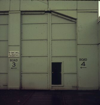Tram depot front with personell door open