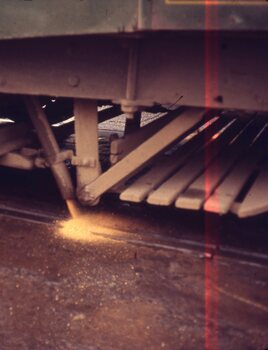  sand being discharged from a bogie tram