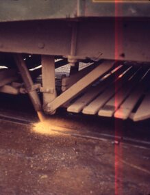  sand being discharged from a bogie tram