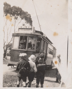 George Wilson boarding a Geelong tram on his first day of school late 1920's