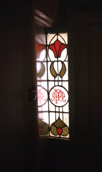 photos of a PMTT stained glass window built in to a door way