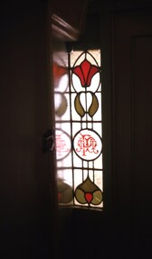 photos of a PMTT stained glass window built in to a door way