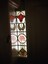 photos of a PMTT stained glass window built in to a door way