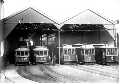 Geelong Tramway Depot with trams and personnel. Staff are attired in MESCo uniform - c1942