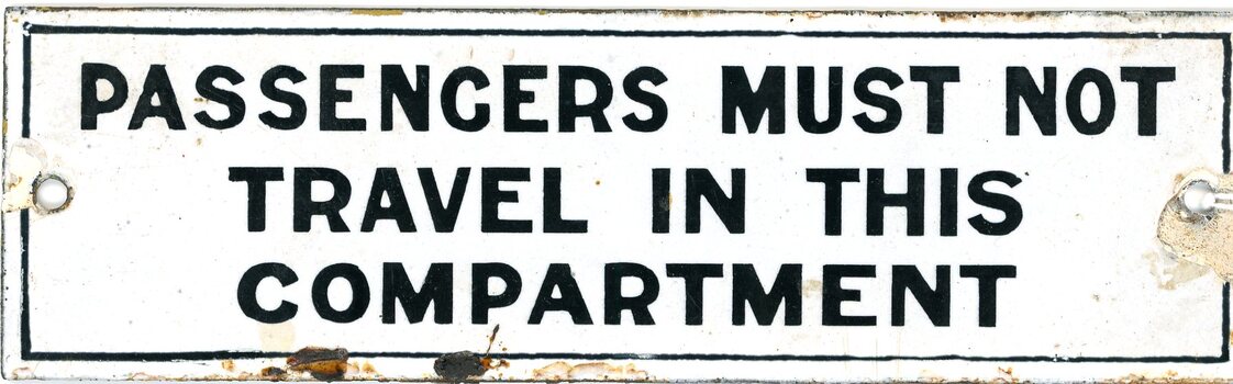 Enameled sign with passenger information "Passengers must not travel in this compartment"