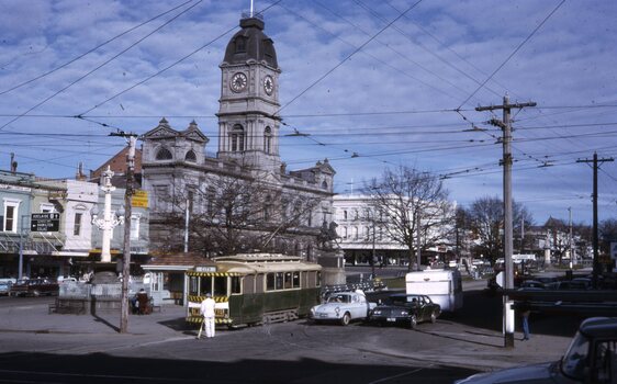 Street cleaner and tram 12