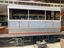 Truck positioned under tram
