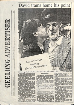 A newspaper clipping titled "GEELONG ADVERTISER" featuring a black and white photo of a man in a tram driver's uniform, being kissed on the cheek by a woman holding a document titled "History of the Geelong Electric Tramways."