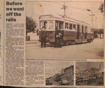A vintage electric tram with the number 36 on its front, stopped on a track near a city center, with two uniformed staff members standing beside it.