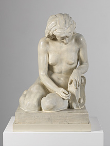 Sculpture of a naked woman, slumped onto her knees, with head bowed. She leans on a tambourine, and is seated on a square base