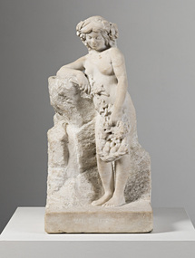 Off-white marble statue of a naked woman with a basket of fruit loosely held in her left hand and tipping outwards over her knees. Her right arm leans on a rock. Her feet stand on a rectangular base.