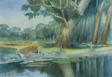Landscape featuring a large tree beside river in foreground, with further vegetation and sky in background.