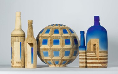  Five ceramic works comprising of a sphere shaped vessel and four bottles with detailed, geometric patterns across surface.