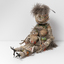 Small woven sculpture of a two figures, a larger female figure and a small child in her lap. Made of woven feathers, cloth, fibre, fur, wood, crow's feet.