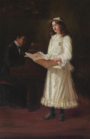 An interior scene with dark background. A girl in the foreground wearing cream dress with ruffled collar, hem and long sleeves, stands holding a song book. She has shoulder length dark curly hair with a ribbon in it, wears a gold brooch and black stockings and shoes. A male figure wearing a dark suit sits at a piano behind her to the left slightly in shadow
