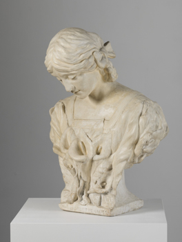 Cream plaster bust of woman. Her hair is parted at the centre, and her head is slightly bowed. She wears a garment with a square neckline. Trumpet lilies cover her bust.