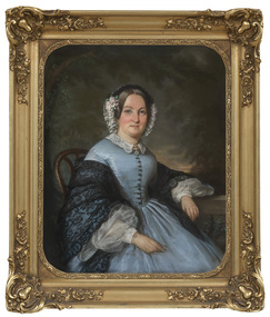 Portrait of seated lady in the dress in the style of the 1859s. She wears grey dress with buttons down the front, white lace cuffs, dark lace shawl over her arms. Her hair is parted and she wears head piece with lace and flowers