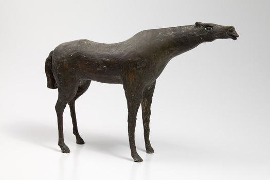 Bronze sculpture of a standing horse, head extended