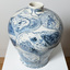 Large-scale blue and white ceramic, inspired by early Chinese willow-pattern vessels, depicting images of and social commentary around Victorian surfer Wayne Lynch.