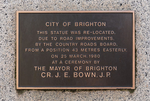 Bronze plaque attached to granite base