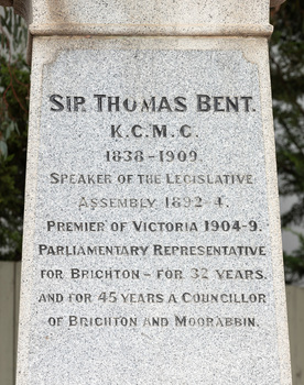 Carved inscription in black on a grey granite plinth