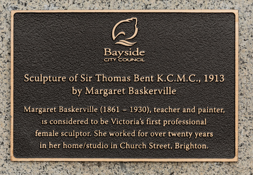 Bronze plaque attached to granite base
