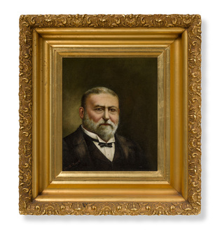 Formal portrait painting of a man, from chest up in dinner suit with small bow tie. He has grey hair and beard. Housed in a thick, ornate gold frame.
