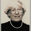 Black and white photographic portrait of a woman with short white hair and glasses.