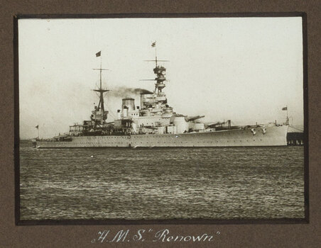 Black and white photograph of a large ship with 2 masts.
