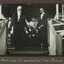 Black and white photograph of 2 men in ceremonial robes standing at the top of a stair case.