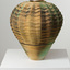 Vase with wavy pattern in bronze and green tones on a white plinth