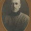 Black and white photograph of a man with short hair wearing a woolen turtleneck 