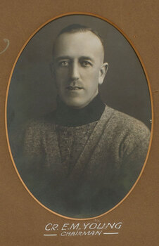 Black and white photograph of a man with short hair wearing a woolen turtleneck 