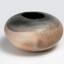 A round terracotta vase in pink and grey tones.