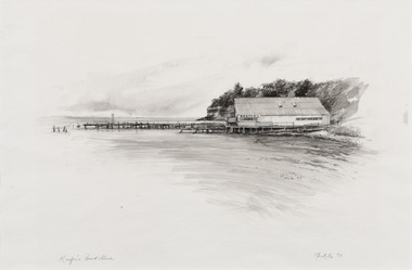 Black and white image of a boat shed on a shoreline, with long jetty extending to left into water