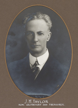 Black and white photograph of an oval portrait of a man in with white hair