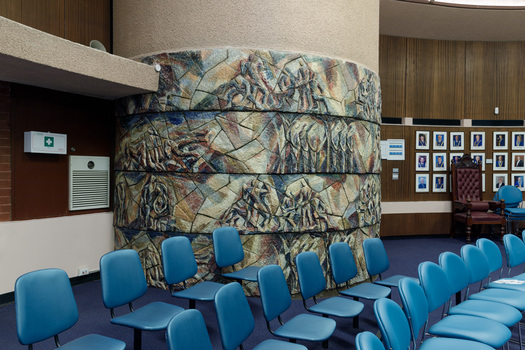 Photograph of a curved ceramic mural within Brighton Council Chambers