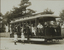 Black and white photograph of children on an open tram