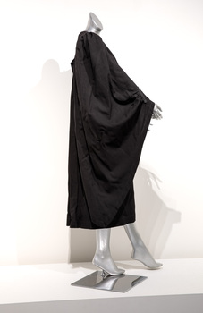 Photograph of a black ceremonial robe on a silver mannequin.